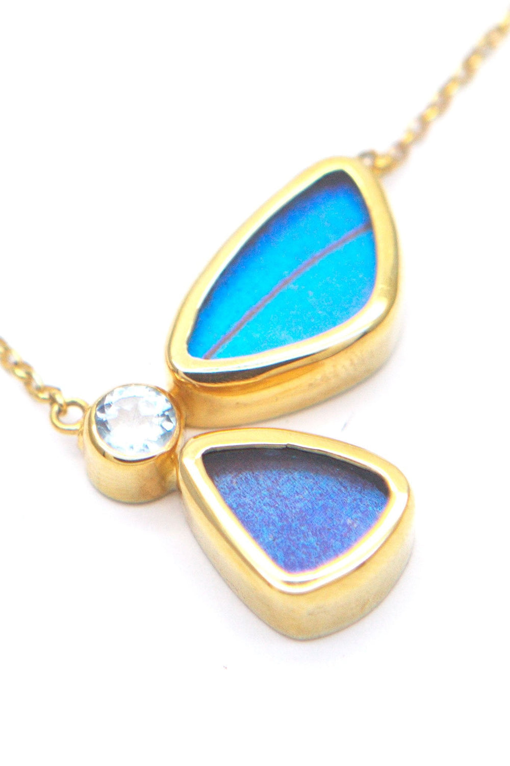 2--A-2B-6F-Gold-butterfly-necklace-with-blue-topaz-birthstone-Iridescent-Blue-half-Morpho-Didius